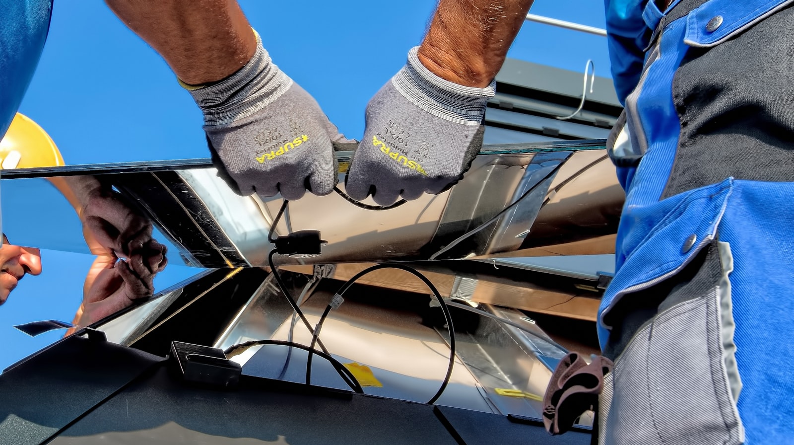 Solar technicians servicing a rooftop system